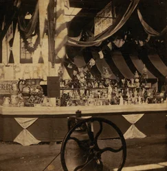 Half-view Stereograph of Table with Various Pieces of Merchandise